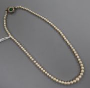 An early 20th century single strand graduated cultured pearl necklace, with green cabochon set
