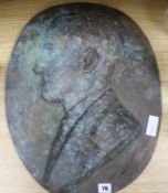 A bronze portrait relief signed "G. Vab Der Straeten" length 53cm