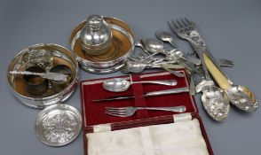 A pair of modern silver bottle coasters, a cased silver Christening set and sundry silver and plated