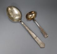 A Danish white metal basting? spoon and a Danish white metal sauce ladle.