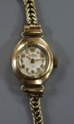 A lady's 9ct gold Bentimo manual wind wrist watch on a 9ct gold bracelet.