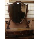 A George III and later bow fronted mahogany toilet mirror W.54cm