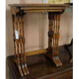 A nest of three yew wood tables W.51cm