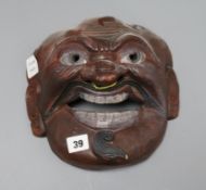 An Asian mask width 23.5cm