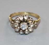 A 19th century yellow metal and rose cut diamond set cluster ring, with carved shank, size L.
