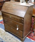 A George III oak bureau W.84cm