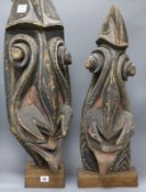 Two New Ireland? pigmented wooden masks height 81cm