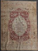 A Qum silk rug, with central medallion, on a beige ground, with six row border, 5ft 3in by 4ft.