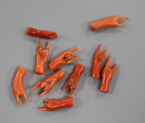 Ten miniature carved coral "hands".