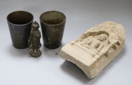 A carved lime stone Indian Stele and an Indian bronze and two Indian beakers carving length 26cm