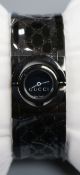 A lady's black steel Gucci Twirl quartz wrist watch, model no. YA1125531, with Gucci box and bag.