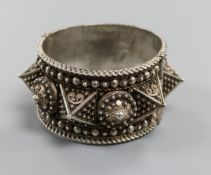 A large Lebanese white metal hinged bangle.