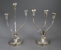 A pair of Peruvian Camusso sterling silver three stem candelabra, loaded, 28.3cm.