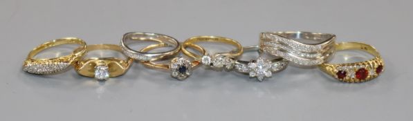 Eight assorted gold and gem set rings including diamond, 18ct(7) and 9ct(1)