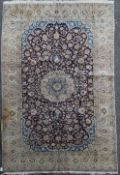 An Isfahan carpet, with field of scrolling foliage, on an ivory ground, 8ft 4in by 4ft 8in.