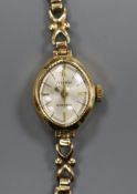 A lady's 9ct gold Accurist manual wind wrist watch.