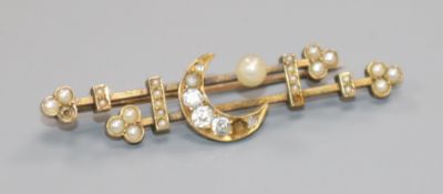 An early 20th century yellow metal, seed pearl and diamond set "crescent & moon" bar brooch,