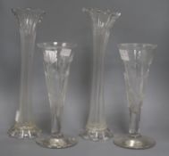 A pair of tall fluted cut glass vases and a pair of cut glass trumpet vases tallest 41cm