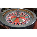 A roulette wheel by "John Huxley" Grosvenor casino diameter 80cm approx.