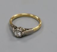 An 18ct gold, platinum and illusion set solitaire diamond ring, size J.