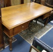 An early 20th century French oak writing table W.180cm