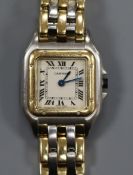 A lady's Cartier Panthere steel and gold quartz wrist watch, with Cartier pouch.