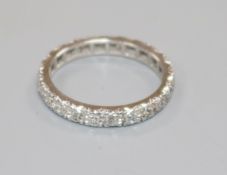 A white metal and diamond set full eternity ring, size K/L.