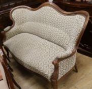 A French walnut showframe settee, W.176cm