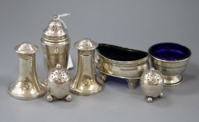Two pairs of silver pepper pots, a single pepper pot and two salts.