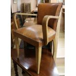 An Art Deco tan leather desk chair