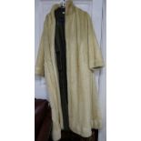 A blonde full length mink fur coat with detachable rain coat