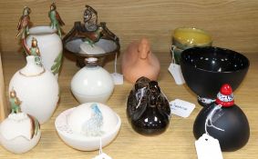 A collection of small studio glass and pottery items, including a black, red and white glass perfume