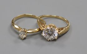 A 14ct gold and solitaire marquise diamond ring and a 14ct gold and cubic zirconia ring.