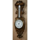 An Edwardian oak banjo barometer W.25cm