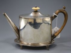 A George III silver teapot with associated stand, the teapot, London 1792, makers: George Smith &