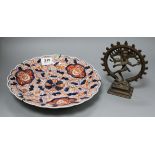 An Imari dish and a small bronze deity diameter 30.5cm