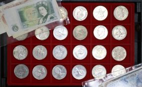 A collection of assorted British and foreign coinage in two cases.