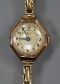 A lady's 9ct gold wrist watch, retailed by Samuel, on a 9ct gold flexible bracelet.