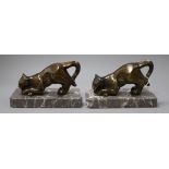 A pair of Art Deco panther bookends, on marble base, length 17cm