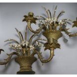 A pair of wall sconces designed as baskets of flowers