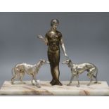 An Art Deco spelter silvered metal model of a girl with two dogs, on marble base height 37cm