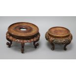 Two Chinese hardwood stands largest 20cm diameter