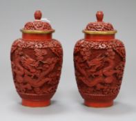 A pair of Chinese cinnabar lacquer dragon jars and lids height 18cm