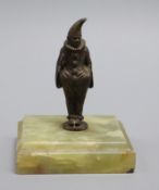 A small bronze pierrot, on green onyx base