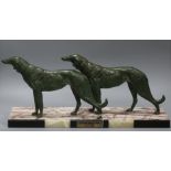 A bronzed metal Art Deco model of Borzoi dogs length 56cm