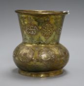 A Cairo ware brass vase, in the form of a mosque lamp, having wide tapered neck with pierced