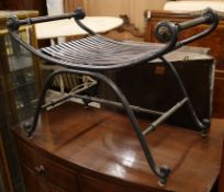 A wrought iron X shaped stool W.78cm