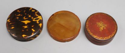Three circular boxes - two wood and one tortoiseshell