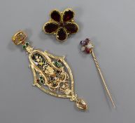 A yellow metal gem set and enamel pendant, a garnet set brooch and a gem set stick pin.