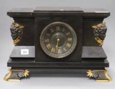 A Victorian black slate mantel clock with bronze masks length 41cm